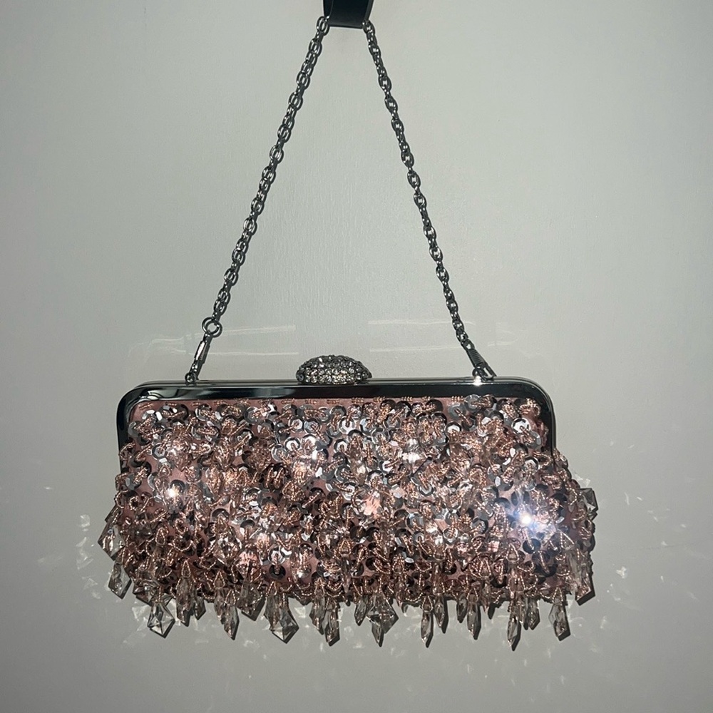 Pink sequin clutch handbag with a silver chain and pink satin inside!